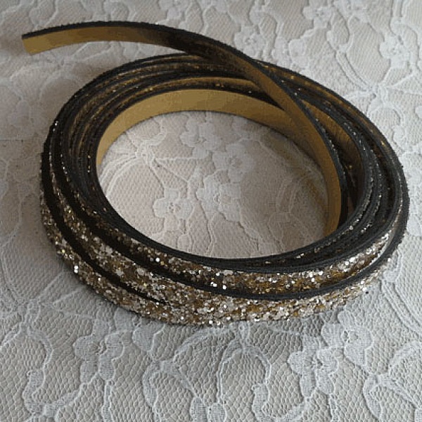 06 mm gouden glitterband met lederen voering per 20 cm