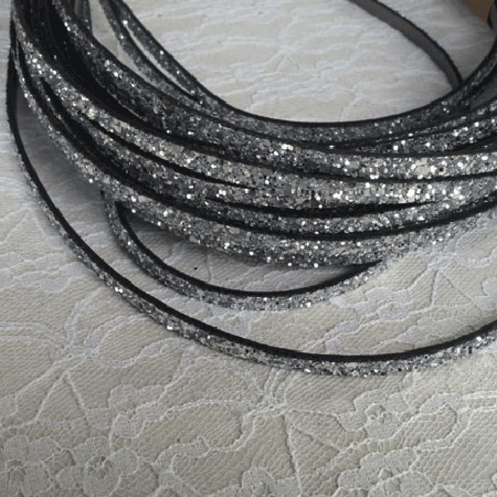 Zilveren glitterband 06 mm met leren voering per 20 cm