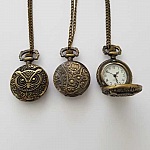 Antiek bronzen uilhorloge met ketting