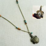 Lange hanger schildpad met parels 