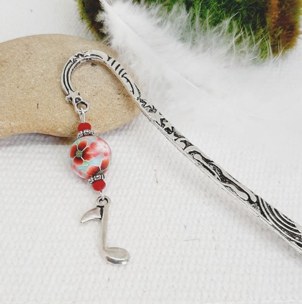 boekenlegger met zilveren muzieknoot thema en mooie handgemaakte klaproos ontwerp