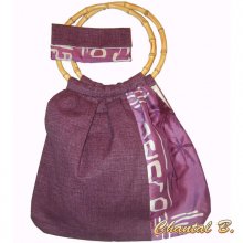 Paarse schoudertas en clutch bag met zijde en katoenen bamboepatroon