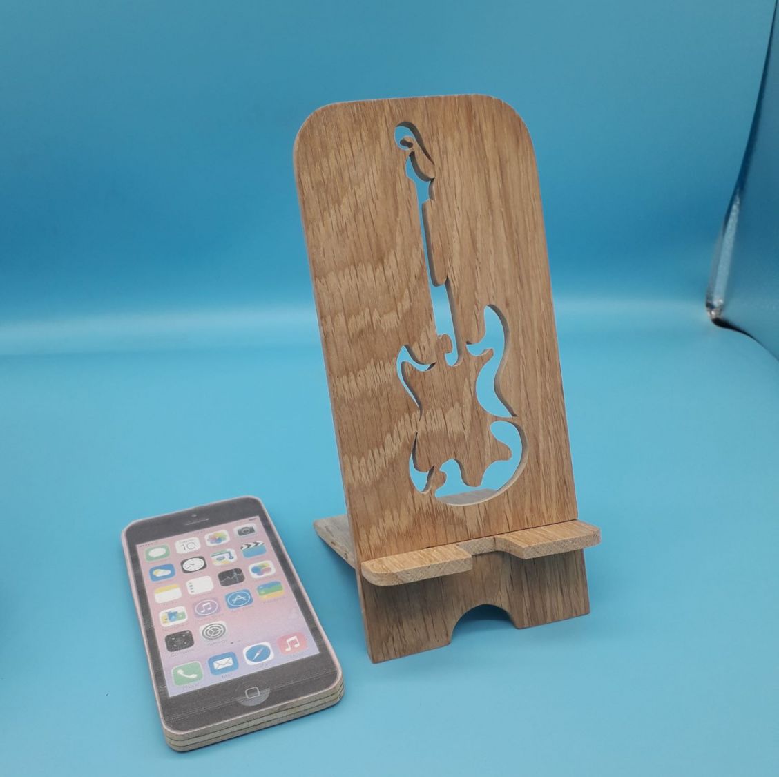 Verticale mobiele telefoonhouder met gitaarmotief