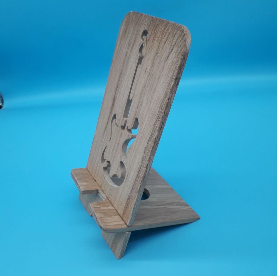 Verticale mobiele telefoonhouder met gitaarmotief