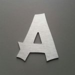 Geborstelde metalen letter CANCUN