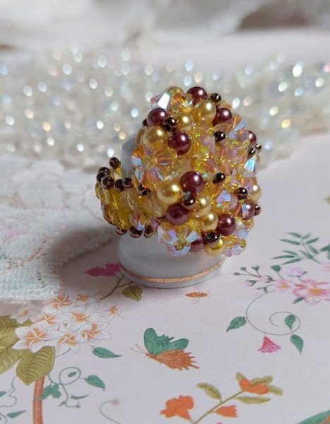Sunshine ring met facetten, parelkraaltjes en Swarovski kristallen spinners