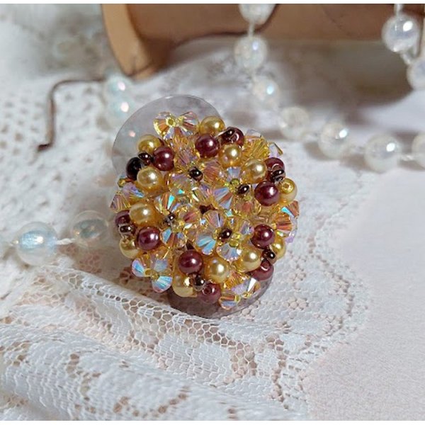Sunshine ring met facetten, parelkraaltjes en Swarovski kristallen spinners