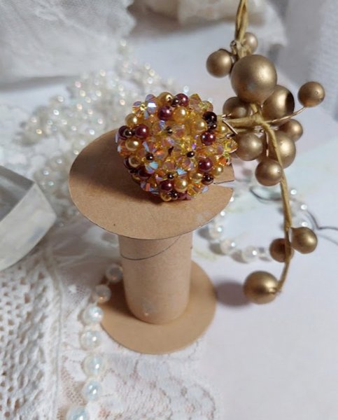 Sunshine ring met facetten, parelkraaltjes en Swarovski kristallen spinners