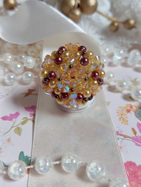 Sunshine ring met facetten, parelkraaltjes en Swarovski kristallen spinners