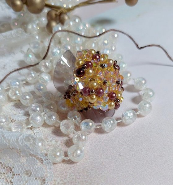 Sunshine ring met facetten, parelkraaltjes en Swarovski kristallen spinners