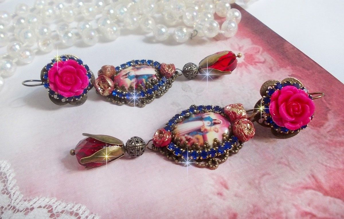 BO Maria en Jezus gemaakt met hars cabochons, rode facetperen en diverse accessoires