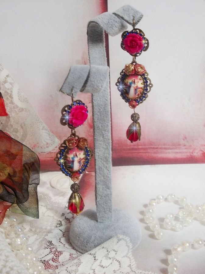 BO Maria en Jezus gemaakt met hars cabochons, rode facetperen en diverse accessoires