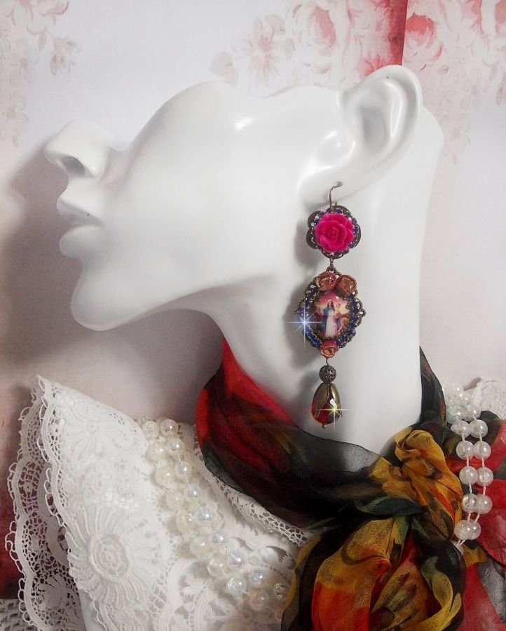 BO Maria en Jezus gemaakt met hars cabochons, rode facetperen en diverse accessoires