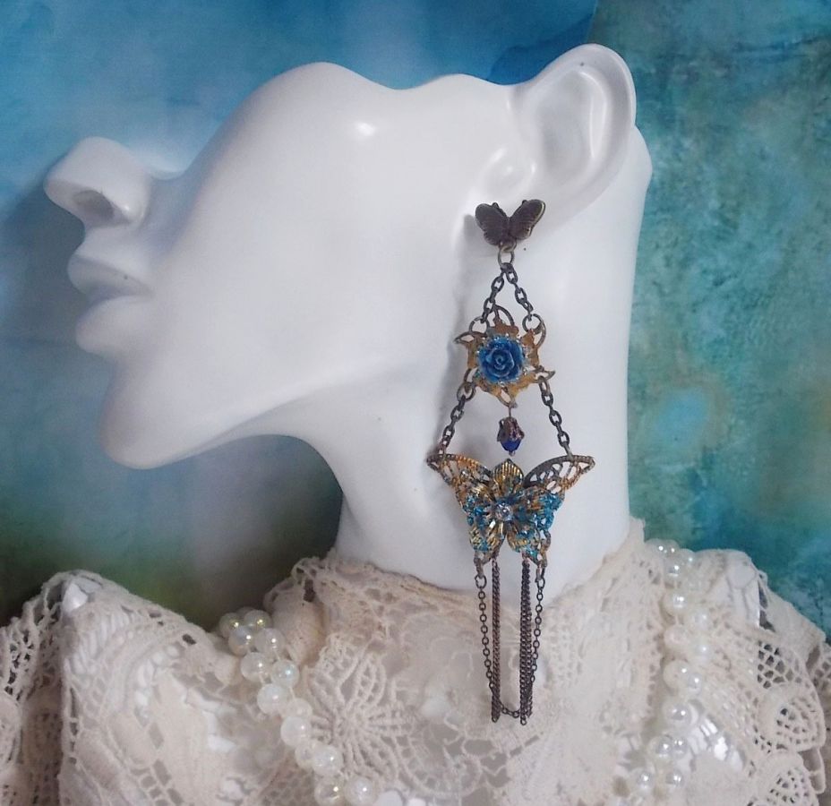 Iriserende vlinders gemaakt met zirkonium, Swarovski kristallen, hars cabochons, diverse accessoires en Boheemse glaskralen.