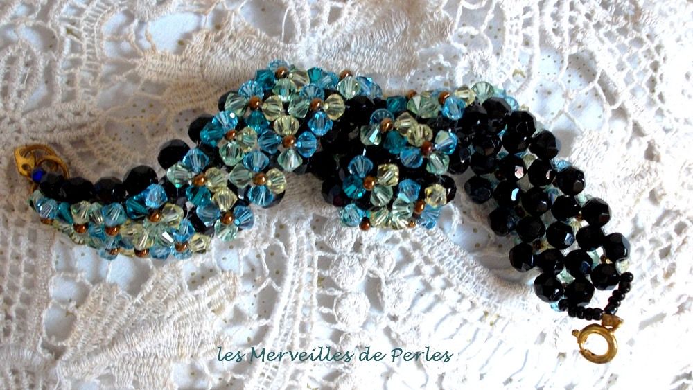 Fonkelende Aurora armband met zwarte facetten en gekleurde tollen in Swarovski kristal