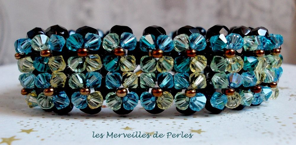 Fonkelende Aurora armband met zwarte facetten en gekleurde tollen in Swarovski kristal
