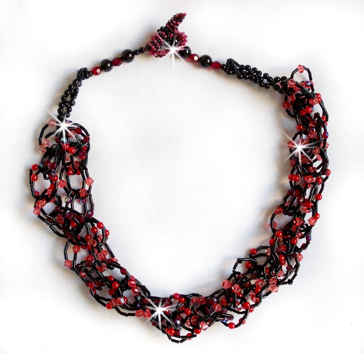 Voel ketting met buiskralen, Swarovski kristallen en facetten