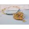 Haute-Couture Sunflower Gold hanger geborduurd met 24 karaats vergulde rocailles, een Madagaskar opaal en Swarovski kristallen.