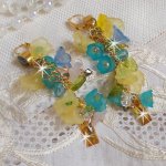 BO Bella Geel gemonteerd met Swarovski kristallen, matte bloemen en parels 