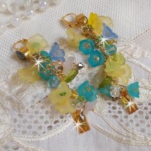BO Bella Geel gemonteerd met Swarovski kristallen, matte bloemen en parels 