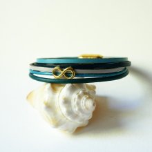 Multilink-armband van blauwkleurig leer met gouden infinity-motief