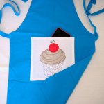 Geborduurd kinderschort cup cake